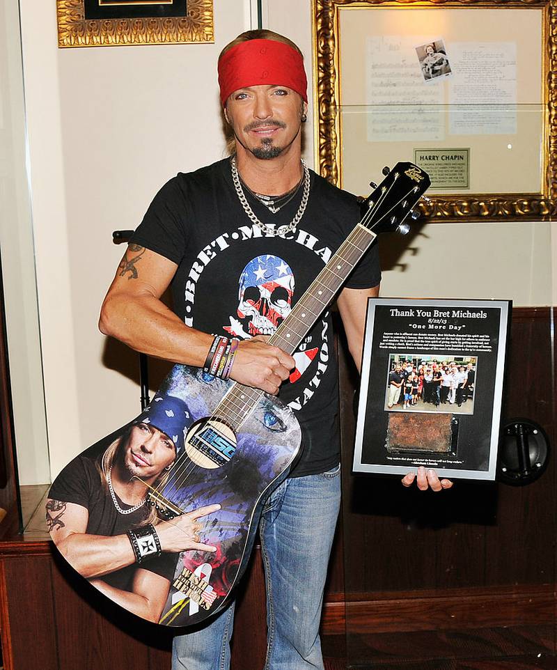 NEW YORK, NY - JULY 18:  Singer/TV personality Bret Michaels poses for a photo with the guitar he donated to Hard Rock Cafe at Hard Rock Cafe New York on July 18, 2014 in New York City.  (Photo by Stephen Lovekin/Getty Images)